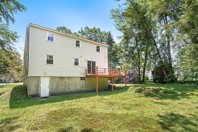 98 G St, Dracut, MA 01826 - rear view of house with a wooden deck and a yard