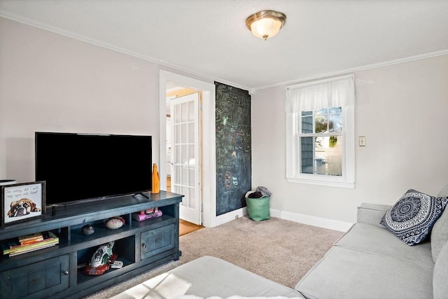carpeted living room featuring crown molding and baseboards
