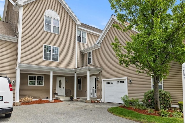18 Dale St Unit 7A, Andover, MA 01810 - view of front of house with asphalt driveway and a garage