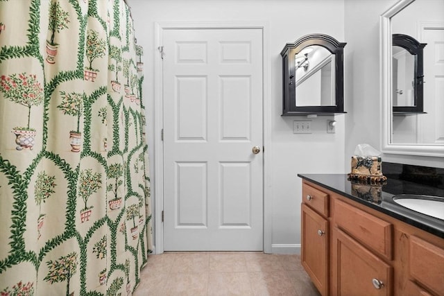 18 Dale St Unit 7A, Andover, MA 01810 - bathroom with vanity, tile patterned floors, a shower with shower curtain, and baseboards