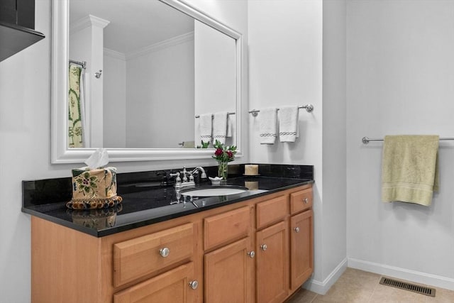 18 Dale St Unit 7A, Andover, MA 01810 - bathroom featuring vanity, ornamental molding, baseboards, and tile patterned flooring