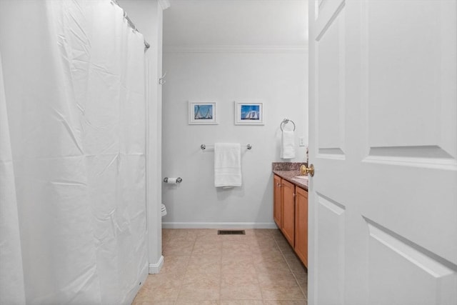 18 Dale St Unit 7A, Andover, MA 01810 - full bath with toilet, vanity, crown molding, tile patterned flooring, and baseboards