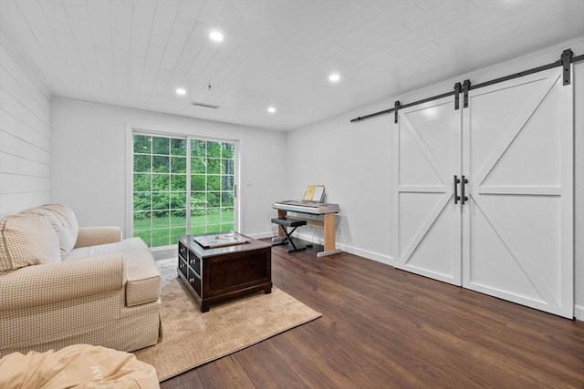 18 Dale St Unit 7A, Andover, MA 01810 - living room with a barn door, dark wood-type flooring, and recessed lighting