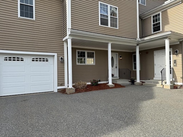 18 Dale St Unit 7A, Andover, MA 01810 - view of front of house featuring an attached garage and covered porch