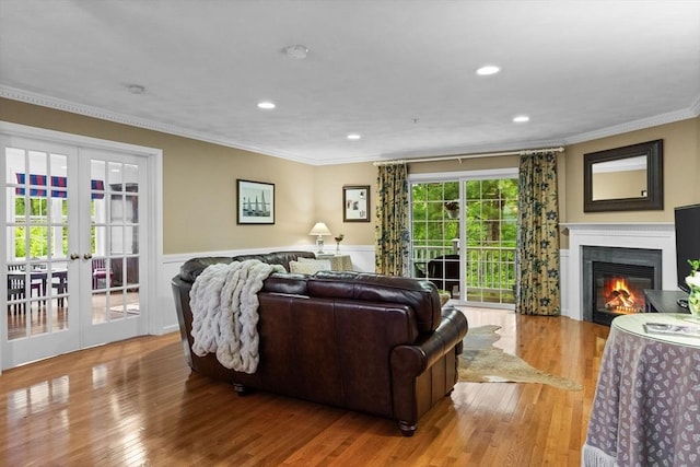 18 Dale St Unit 7A, Andover, MA 01810 - living room with french doors, crown molding, wainscoting, wood finished floors, and recessed lighting