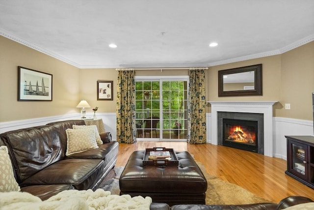 18 Dale St Unit 7A, Andover, MA 01810 - living room featuring wood finished floors, a wainscoted wall, crown molding, a glass covered fireplace, and recessed lighting