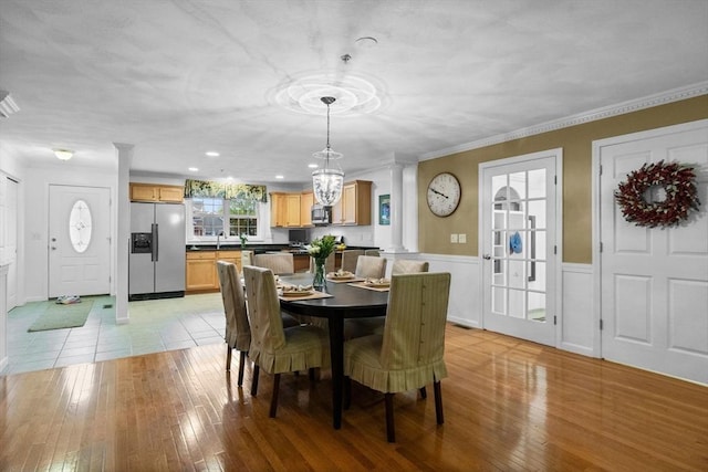 18 Dale St Unit 7A, Andover, MA 01810 - dining room with ornate columns, ornamental molding, light wood-style flooring, a wainscoted wall, and recessed lighting