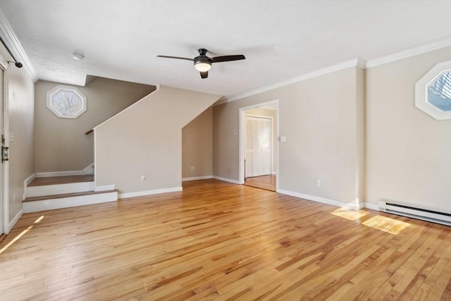 unfurnished living room featuring stairs, ceiling fan, light wood finished floors, and crown molding