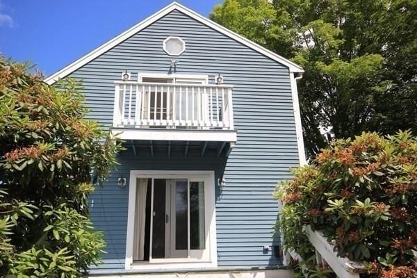 rear view of house with a balcony