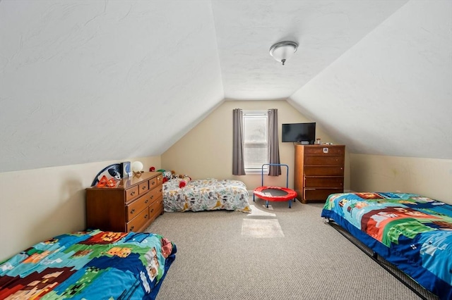 carpeted bedroom featuring vaulted ceiling