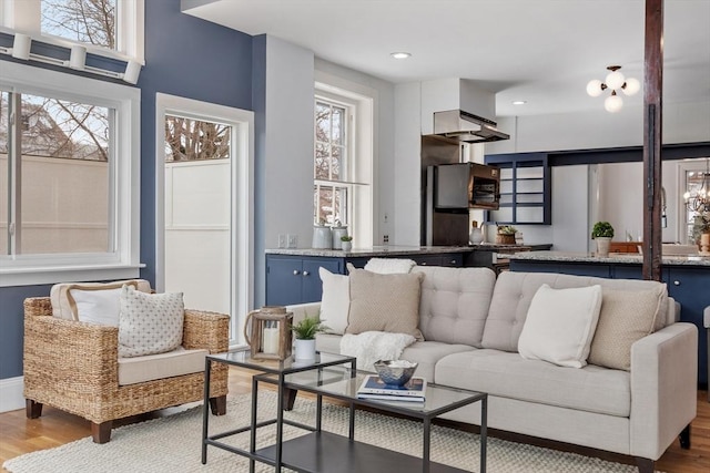 living room with light hardwood / wood-style floors