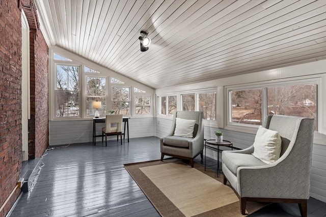 sunroom / solarium featuring lofted ceiling and wood ceiling