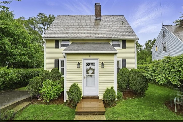 13 Delaval Rd, Worcester, MA 01606 - view of front of house with a chimney and a front lawn