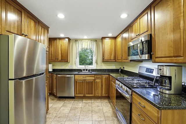 13 Delaval Rd, Worcester, MA 01606 - kitchen with appliances with stainless steel finishes, a sink, brown cabinets, recessed lighting, and dark stone counters