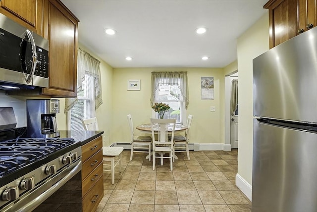 13 Delaval Rd, Worcester, MA 01606 - kitchen with appliances with stainless steel finishes, recessed lighting, baseboards, dark countertops, and a baseboard radiator
