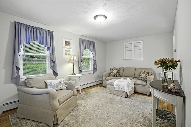 13 Delaval Rd, Worcester, MA 01606 - living area with a baseboard heating unit and wood finished floors