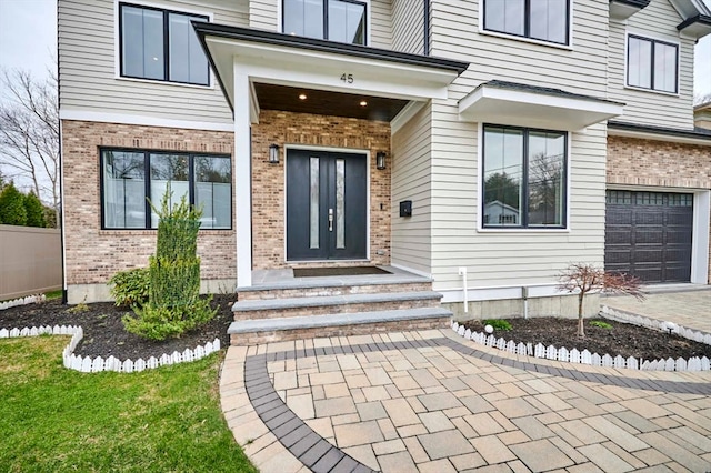 doorway to property featuring a garage