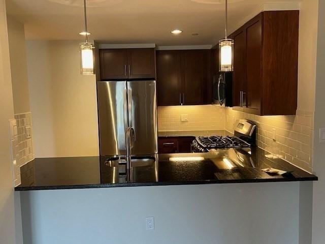 321 Hammond Pond Pkwy Unit U301, Brookline, MA 02467 - kitchen featuring appliances with stainless steel finishes, a peninsula, a sink, dark brown cabinetry, and backsplash