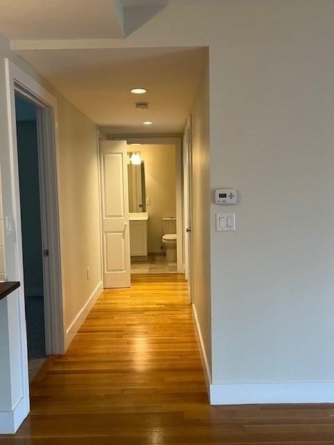 321 Hammond Pond Pkwy Unit U301, Brookline, MA 02467 - corridor with light wood-style floors, baseboards, and recessed lighting
