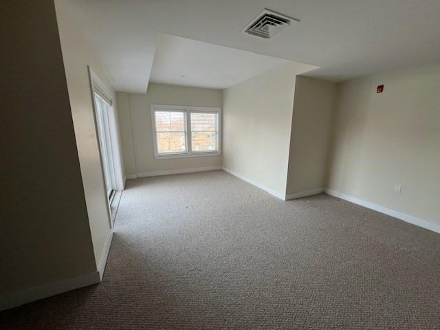 321 Hammond Pond Pkwy Unit U301, Brookline, MA 02467 - unfurnished room featuring baseboards and carpet