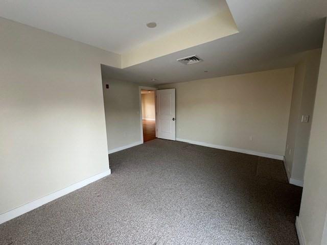 321 Hammond Pond Pkwy Unit U301, Brookline, MA 02467 - empty room featuring baseboards and dark carpet