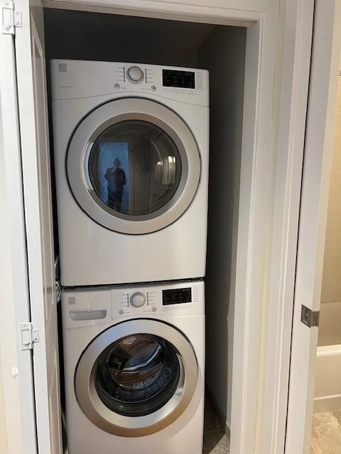 321 Hammond Pond Pkwy Unit U301, Brookline, MA 02467 - clothes washing area with estacked washer and dryer