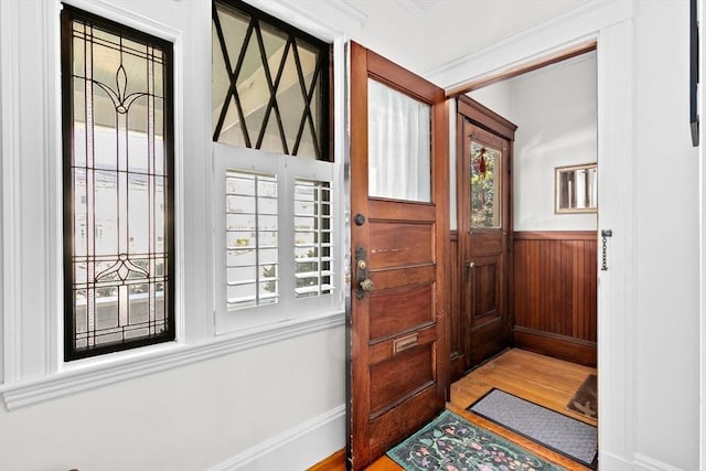 foyer with plenty of natural light and wood finished floors