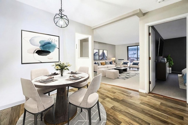 dining room with a notable chandelier and wood-type flooring