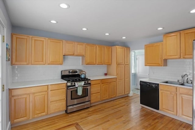127 Mutton Ln, Weymouth, MA 02189 - kitchen with stainless steel gas range, dishwasher, light brown cabinets, a sink, and tasteful backsplash