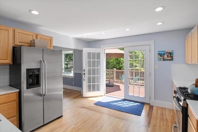 127 Mutton Ln, Weymouth, MA 02189 - kitchen with stainless steel appliances, light brown cabinetry, light wood finished floors, baseboards, and recessed lighting