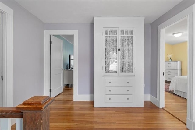 127 Mutton Ln, Weymouth, MA 02189 - corridor featuring light wood-style flooring and baseboards