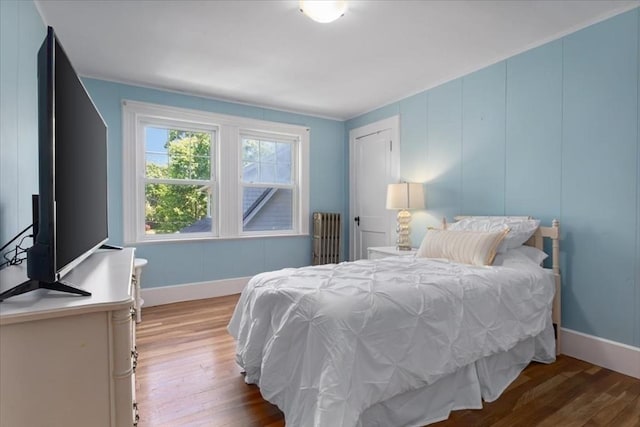 127 Mutton Ln, Weymouth, MA 02189 - bedroom featuring radiator heating unit, wood finished floors, and baseboards