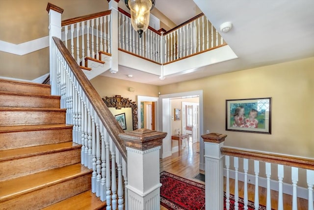 stairs featuring hardwood / wood-style flooring