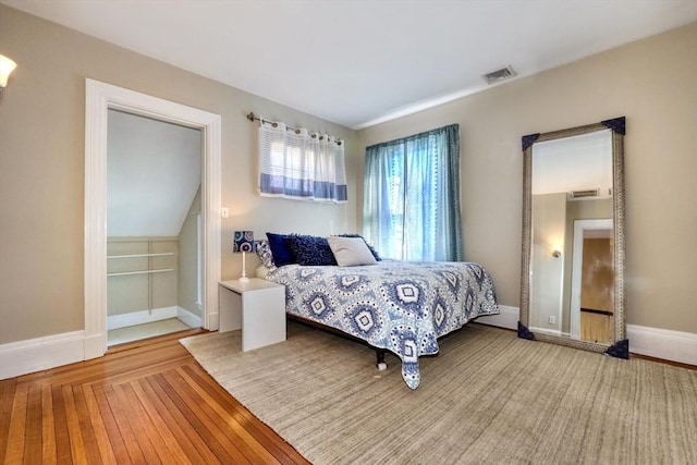 bedroom with hardwood / wood-style flooring