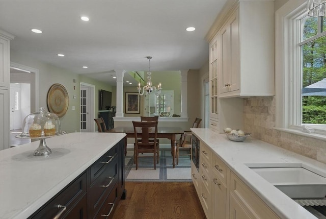 11 Edge Hill Rd, Hopkinton, MA 01748 - kitchen featuring decorative columns, plenty of natural light, dark wood finished floors, recessed lighting, and pendant lighting