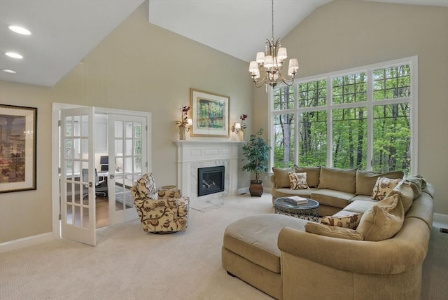 11 Edge Hill Rd, Hopkinton, MA 01748 - living room featuring vaulted ceiling, baseboards, carpet, a fireplace, and a chandelier
