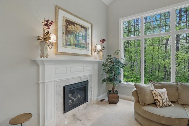 11 Edge Hill Rd, Hopkinton, MA 01748 - living area featuring plenty of natural light, a high end fireplace, carpet floors, and baseboards