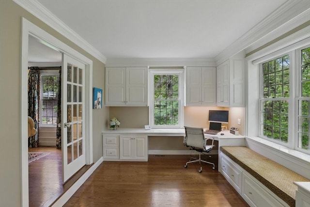 11 Edge Hill Rd, Hopkinton, MA 01748 - home office featuring built in desk, dark wood-style floors, crown molding, baseboards, and french doors