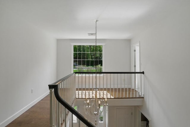11 Edge Hill Rd, Hopkinton, MA 01748 - stairs with a chandelier, wood finished floors, and baseboards