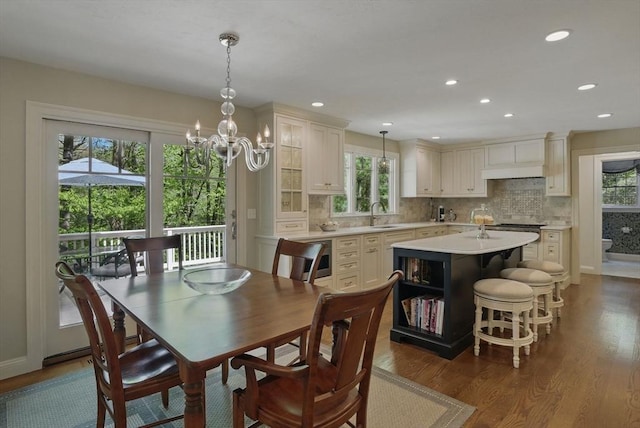 11 Edge Hill Rd, Hopkinton, MA 01748 - dining area with healthy amount of natural light, dark wood finished floors, a chandelier, and recessed lighting