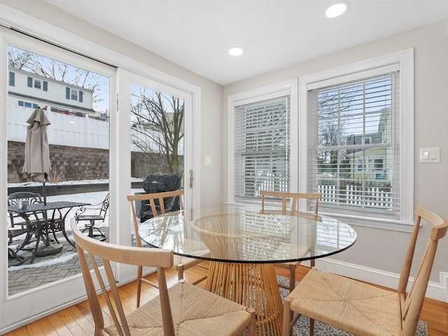 dining area featuring hardwood / wood-style flooring and a wealth of natural light