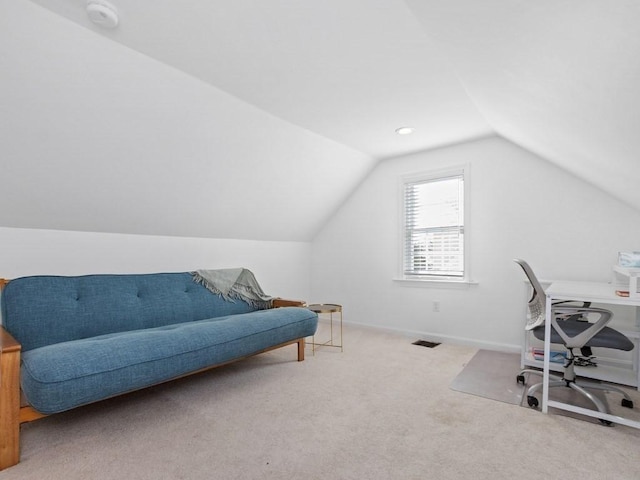 office with vaulted ceiling and carpet floors