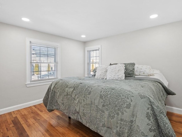 bedroom with wood-type flooring