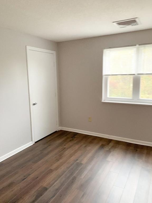 10 Longworth Ave Unit 12, Brockton, MA 02301 - spare room featuring dark wood-type flooring and baseboards