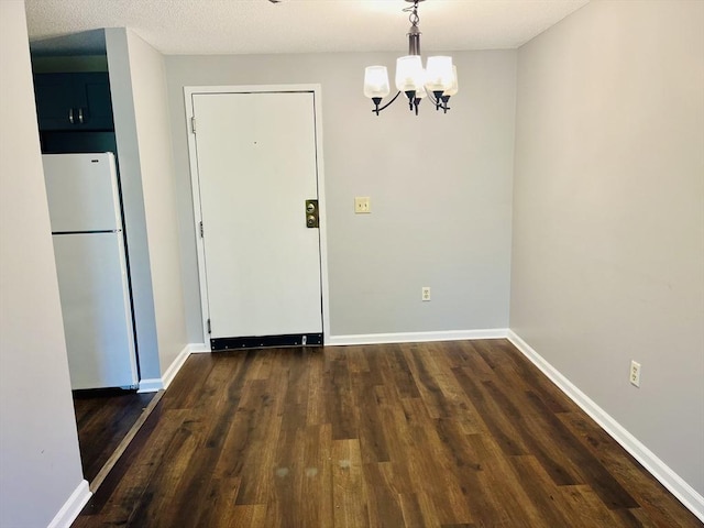 10 Longworth Ave Unit 12, Brockton, MA 02301 - unfurnished dining area featuring a chandelier, dark wood-style floors, and baseboards