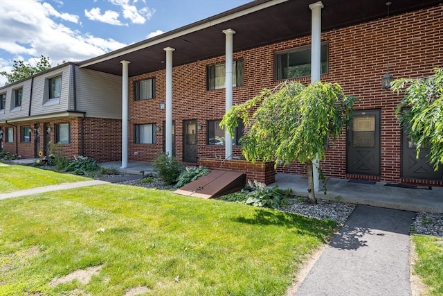 380 Farrwood Unit 380, Haverhill, MA 01835 - view of front of home featuring a front lawn and brick siding