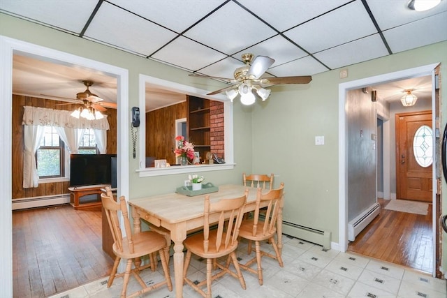 886 Canterbury St, Boston, MA 02131 - dining room with baseboard heating, ceiling fan, light wood-style flooring, and a drop ceiling