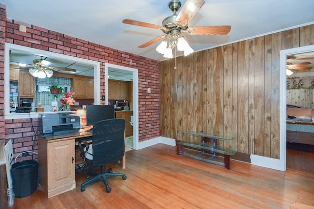 886 Canterbury St, Boston, MA 02131 - office area with ceiling fan, light wood-style flooring, wooden walls, and brick wall