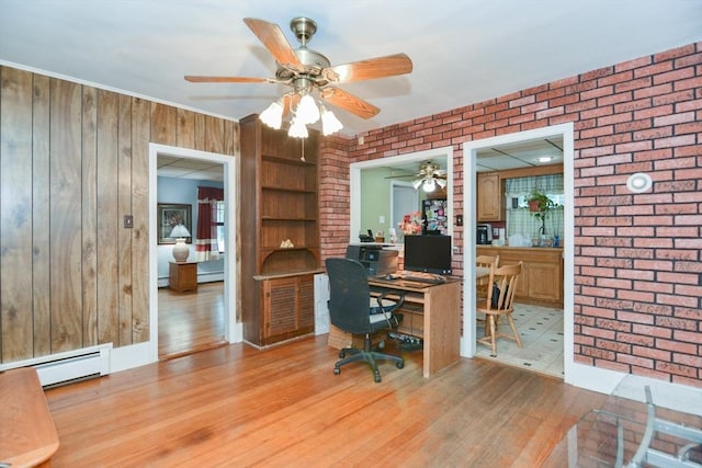 886 Canterbury St, Boston, MA 02131 - home office with baseboard heating, ceiling fan, brick wall, wood finished floors, and wooden walls