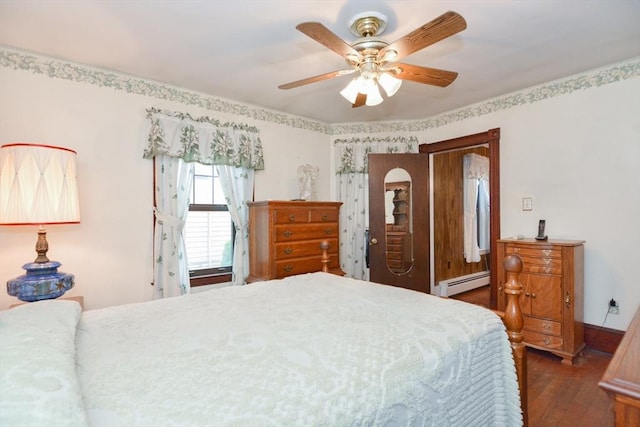 886 Canterbury St, Boston, MA 02131 - bedroom with a baseboard heating unit, wood finished floors, and a ceiling fan